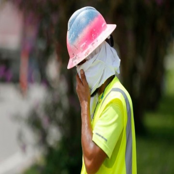 Construction Worker Wipes his Sweat